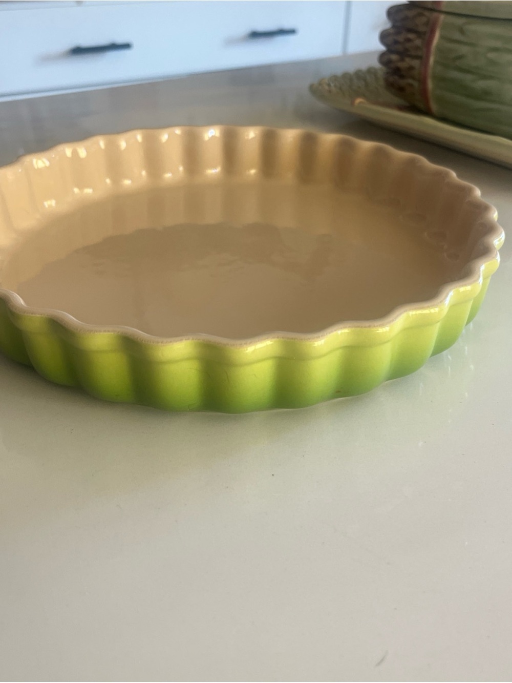 Le Creuset
Ceramic fluted tart 10”across , 2”deep ( apx)
Dish - Green